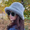 Mink bucket hat made of fake fur. Fashion fluffy hat for women.