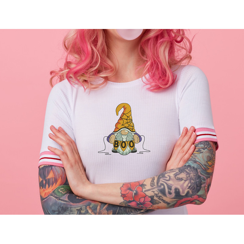 portrait-of-young-amazed-beautiful-pink-haired-lady-with-tattooed-hands-wears-in-white-t-shirt-blows-gum-ball-looking-to-the-left-in-surprise-stands-with-copy-s