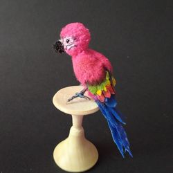 miniature crocheted amigurumi parrot toy