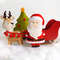 Felt Santa Claus, reindeer Rudolph with Santa's sleigh and Christmas tree toys on the "snow"
