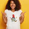 happy-overjoyed-ethnic-lady-with-bushy-crisp-hair-gives-positive-answer-with-thumbs-up-likes-awesome-idea-closes-eyes-from-laugh-dressed-in-mockup-t-shirt-isola