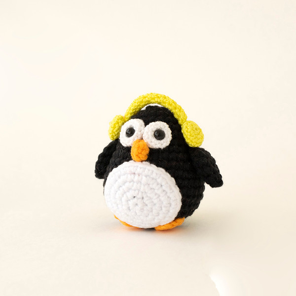 Stuffed penguin with headphones