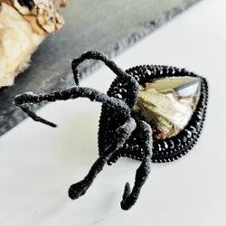 Embroidered beaded brooch. Evil eye, spider paws, black beaded jewelry, natural stone brooch for men and women