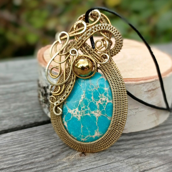 Fancy bronze pendant with sky blue stone 2.jpg