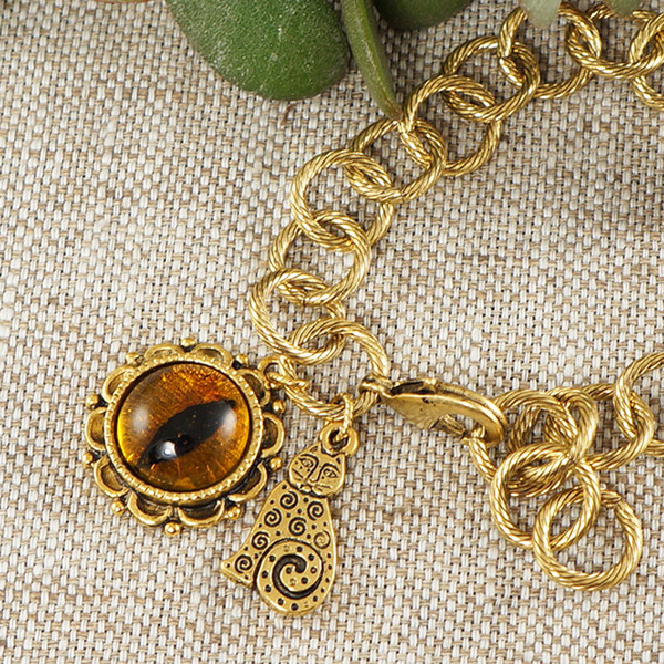 yellow-orange-cat-eye-gold-cat-charm-large-golden-chain-bracelet-jewelry