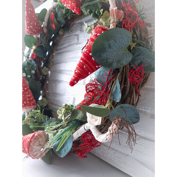 Autumn-wreath- with -fly- agarics- and- artificial flowers
