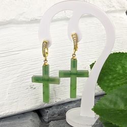 Dainty green jade cross earrings religious and spiritual jewelry.