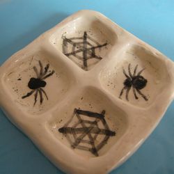 Ceramic palette with web and spiders. Art and painting accessories. Black and white ceramic palette. Halloween theme