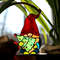 Red-gnome-cap-made-of-beautifully-textured-clear-glass-through-which-the-sun's-rays-pass-a-bright-element-of-the-stained-glass-suncatcher-A-gnome-with-a-Christm