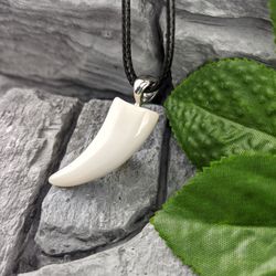 Agate animal fang pendant  a protective amulet for him and for her.