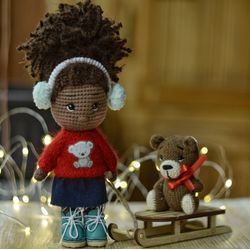 Crochet doll with Christmas sleigh and teddy bear