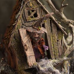 half scale handcrafted witch house with 2 witches