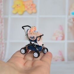 Miniature toy doll stroller in 1/24 scale. Complete with baby doll. Blue handmade stroller.