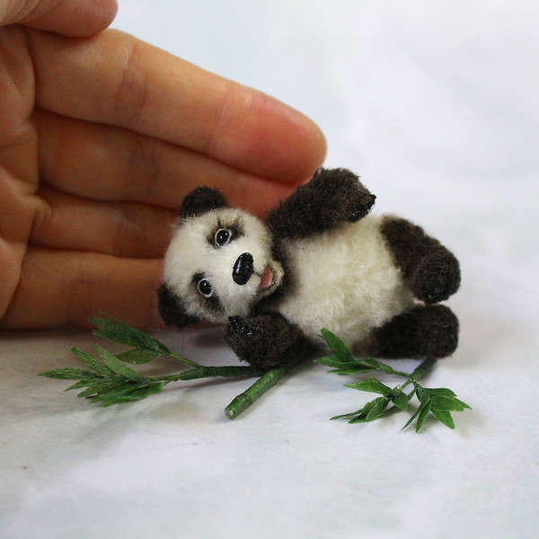 realistic-toy-of-panda-with-bamboo.jpg