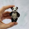 realistic-little-panda-in-hand.jpg