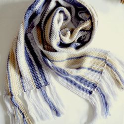 Striped long blue hand-knitted scarf with fringe.
