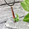 ax pendant made of red jasper and green jade