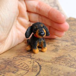 Dachshund Puppy. Miniature figurine. Realistic mini toy