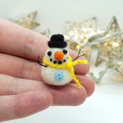Miniature needle felted snowman in a hat