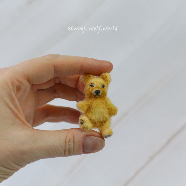 small-realistic-bear-toy-in-hand.jpg