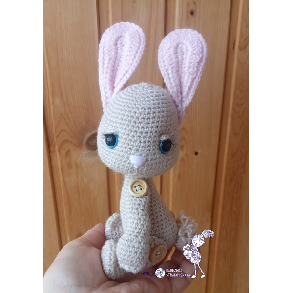Crocheted Chalky bunny in hand