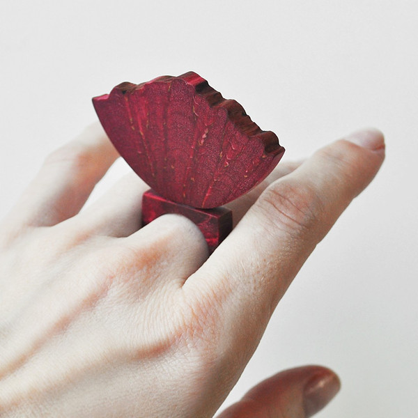 red flower ring on hand 1