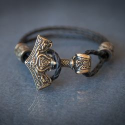 Viking bracelet on leather cord with Thor hammer Mjolnir and beads. Scandinavian Pagan jewelry. Authentic Present