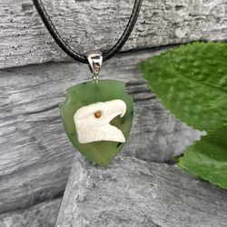 Pendant head of an eagle made of white agate on a shield of green natural jade, jewelry for him and her.