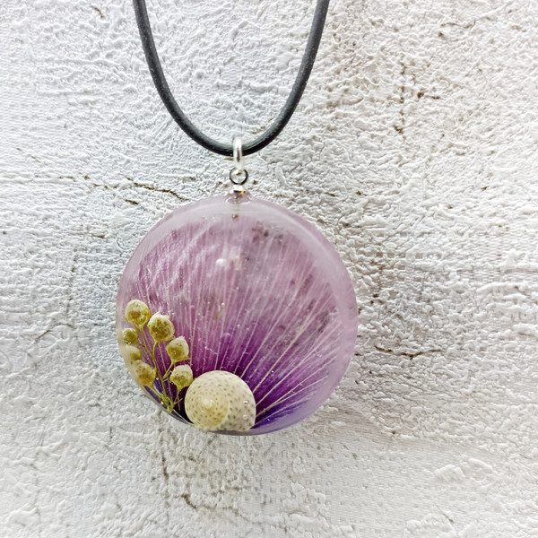purple necklace with a snail____.jpeg