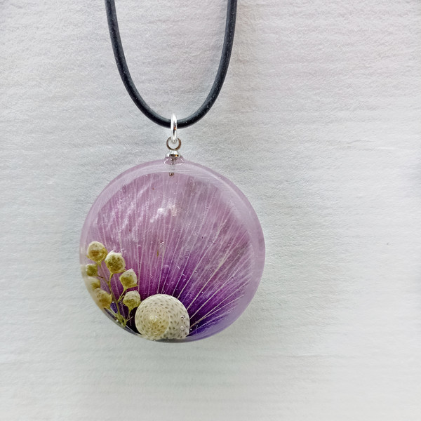 purple necklace with a snail_____.jpeg