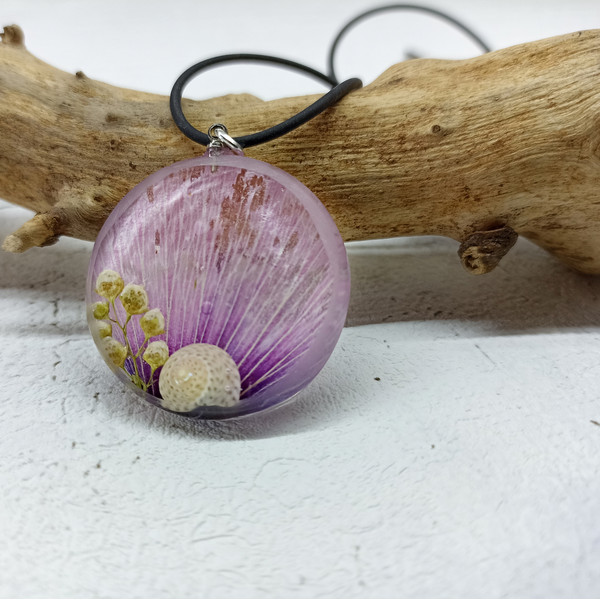 purple necklace with a snail______.jpeg