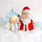 Felt toys Snow maiden and grandfather Frost against the background of snowflakes