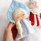 Felt Snow maiden and grandfather Frost toys against the background of snow