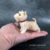 scottish-terrier-realistic-mini-toy-in-hand.jpg