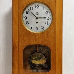 antique pendulum wall clock. soviet vintage wall clock