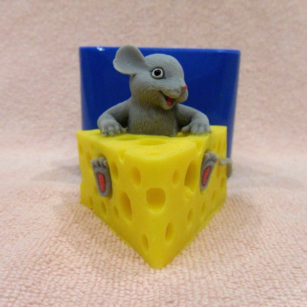 Mouse in a piece of cheese soap and mold