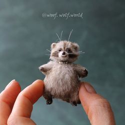 Raccoon. Miniature realistic figurine. Custom-made toy