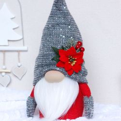 Christmas gnome with poinsettias