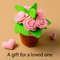 Roses in a pot and small hearts nearby.jpg