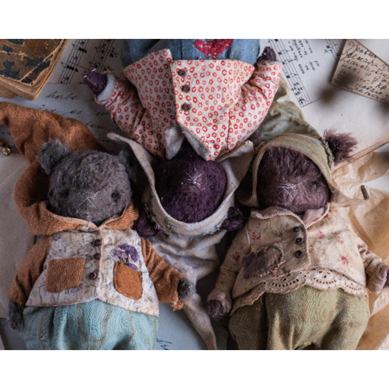 three gnomes in clothes