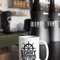 mockup-of-a-15-oz-coffee-mug-against-coffee-grinders-at-a-cafe-27245.png