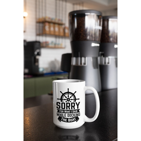 mockup-of-a-15-oz-coffee-mug-against-coffee-grinders-at-a-cafe-27245.png