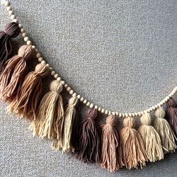 neutral brown tone earth wall hanging yarn tassel garland for bedroom, livingroom and childrenroom.