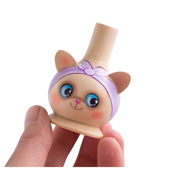 wooden whistle kitty with a light purple bandage