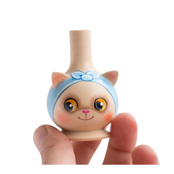 wooden whistle cat with a blue headband