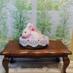 Rabbit in the basket. Puppet miniature.