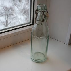 Vintage old glass bottle with ceramic top beer or mineral water