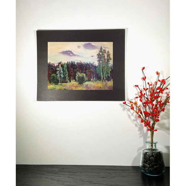 landscape painting hanging on the wall