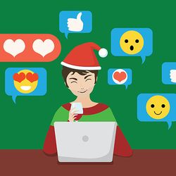 Man with laptop in Christmas hat, chatting online in social media