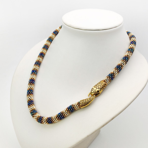gold and purple baded snake necklace